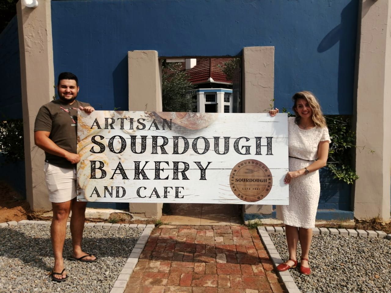 The bakers in front of the bakery